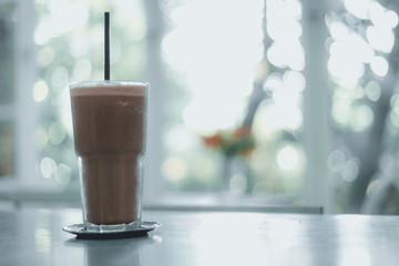 Ice chocolate  on table with blurred background