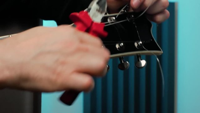 cut the ends of the new strings with a side cutter