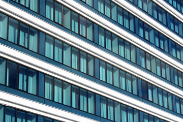 Abstract fragment of modern architecture, walls made of glass and concrete.