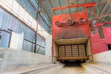 Industrial oven for drying bricks. Production of brick blocks in the factory. Preparing bricks for sale. High temperature oven. Brick oven