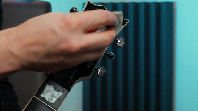 clean the top/head of a guitar with a microfibre cloth