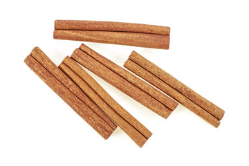 Cinnamon sticks isolated on white background. Top view.