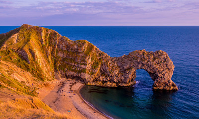 Sunset over Durdle Door - the most famous landmark in Devon England