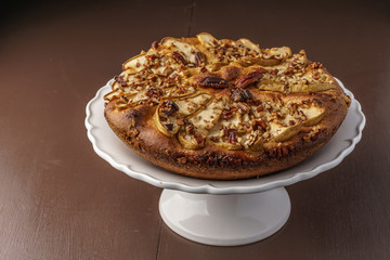 pear cake homemade pastries on a white dish on table.