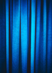 Blue stage textured curtain with vignetting