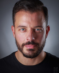 Obraz premium Headshot of young man with blue eyes and beard