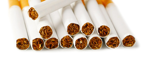 closeup of cigarettes isolated on white background, suitable for header or banner