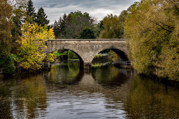Fototapeta na wymiar Bridge Over the River in Fall, Stratford Ontario