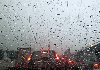 water drop on car window at bad trafic