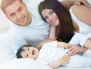 Fototapeta na wymiar Lovely family morning in the bedroom
