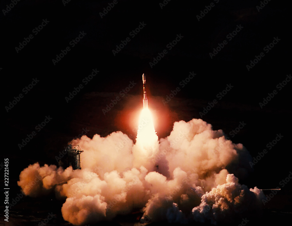 Wall mural launch of the spaceship from the spaceport at night. flight of space shuttle in clouds of smoke. som
