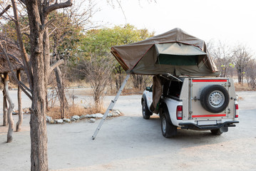 Offroad 4x4 vehicle with tent in the roof