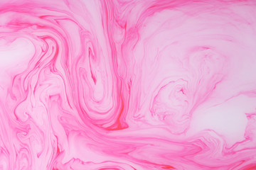 Abstract colored marble background. Stains of paint on the water.