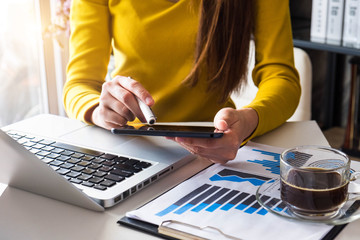 woman hand working with laptop computer, tablet and smart phone in modern office with virtual icon diagram at modern office.
