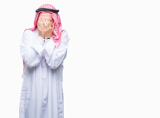 Fototapeta premium Senior arab man wearing keffiyeh over isolated background with sad expression covering face with hands while crying. Depression concept.