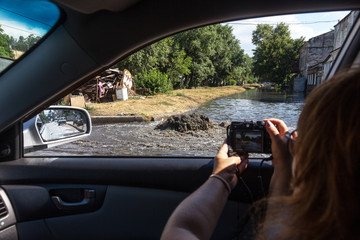 Accident sewerage system. Water flows over the road from sewer. Accident in sewer. Breakthrough sewerage system. Water flows out of manhole. Having poured water supply systems in sewer well on road