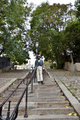 Fototapeta na wymiar Young man in the stairs of Montmartre
