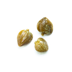 Capers on white background, top view, macro