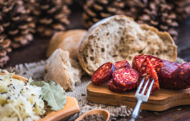 Farmer's Breakfast. Sausage, Sour Cabbage and Bread. Raw Ingredients.