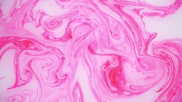 Stains of pink ink on the water. Abstract background footage.