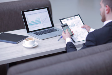 businessman working with new start up project using smart phone