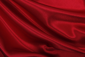 Smooth elegant red silk or satin luxury cloth texture as abstract background. Luxurious valentines...