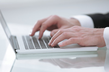 Fototapeta na wymiar close up hands multitasking man using laptop connecting wifi