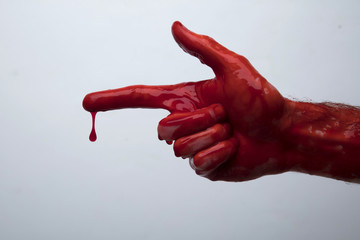 Bloody hand against a light background. halloween horror concept
