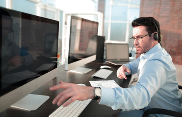 businessman analyzes the data sitting in the office