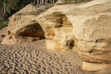 Veczemju Clifs Red Rocks, Latvia. Baltic Sea With Waves, Rocks and Blue Sky Sunny Day.