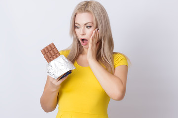 Blonde woman holding chocolate