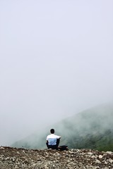 man on top of mountain