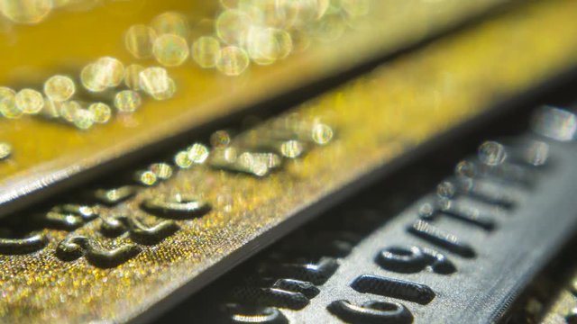 Gold credit cards close up. Macro shot smart card, credit card chip