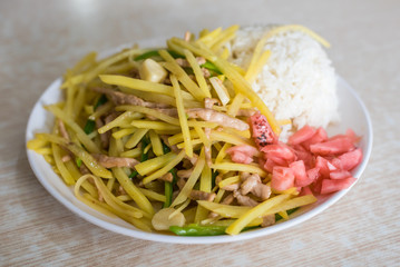 TouDouRouSi ChaoFan - Pork with potatoes and white rice Sichuan food, China