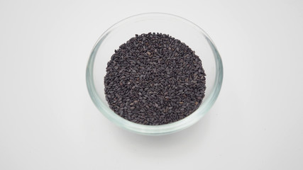 Black sesame seeds  are so nutritious in bowl on white background.