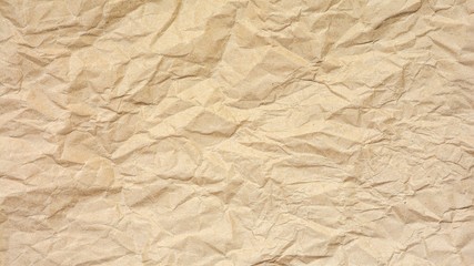 crumpled  natural brown recycled paper texture - background