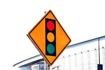 red yellow and green sign label of traffic light on the road in the city