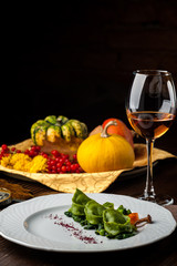 Green Ravioli with quail egg on a black background. A Halloween Feast.