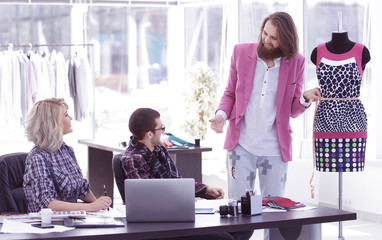 Group of business people brainstorming in a fashion clothing company