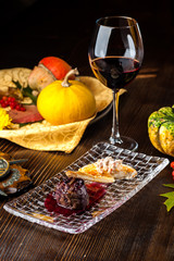 Deer steak on a black background. A Halloween Meal.