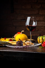 Deer steak on a black background. A Halloween Meal.