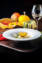 Pumpkin cream soup with fish som. A Halloween Meal.