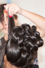 Naklejka premium girl hairdressing with hairdresser woman make hairstyle for celebration wedding day