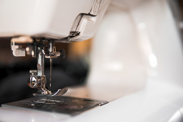 Copy space frame with sewing tools and accessories, traditional business, factory, concept manual work, workplace, electric sewing machine