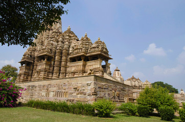 Fototapeta na wymiar KANDARIYA MAHADEV TEMPLE, Facade - South view and platform, Western Group, Khajuraho, Madhya Pradesh, UNESCO World Heritage Site