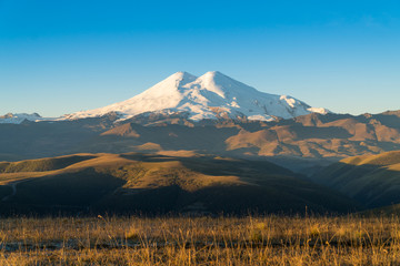 Fototapeta premium Beautifull landscape view of the mount Elbrus - the highest mountain in Europe. Caucasus mountains at autumn season time.