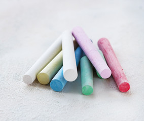 chalks in a variety of colors arranged on a white background