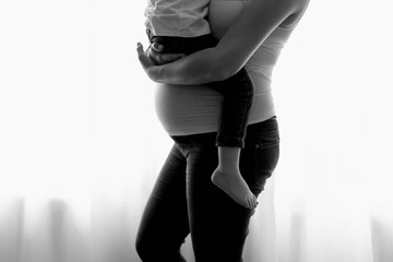 Prengnant mother and daughter, black and white photography