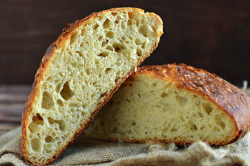 Round wheat bread lying on the jute