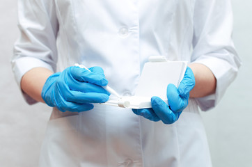 Doctor woman is writing a medical recipe or doctor prescription or diagnostic results concept.